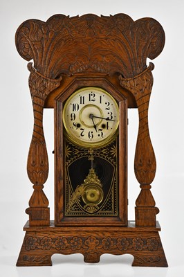 Lot 1181 - NEW HAVEN CLOCK CO; an oak cased eight day...
