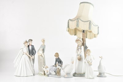 Lot 1225 - NAO; a figural table lamp base modelled as a...