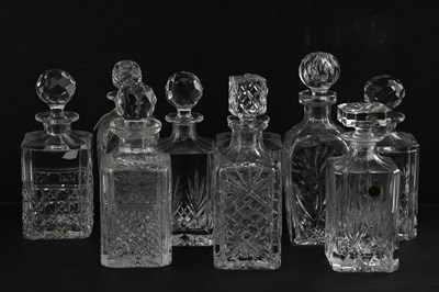 Lot 1612 - A collection of nine cut glass decanters,...
