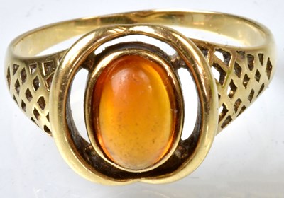 Lot 791 - A yellow metal ring set with an amber-style...
