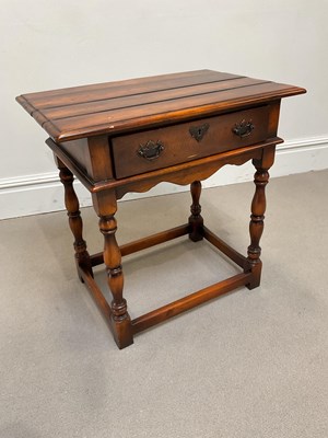 Lot 1074 - A reproduction mahogany single drawer side...
