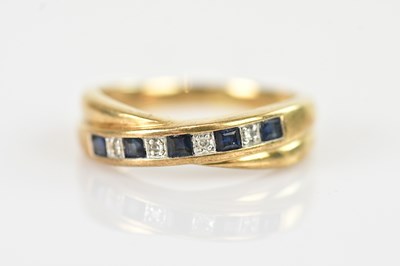Lot 640 - A 9ct yellow gold double band ring set with...
