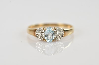 Lot 673 - A yellow metal dress ring set with an oval...