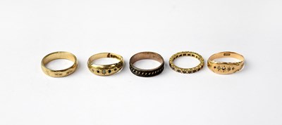 Lot 971 - Four 9ct gold rings, various sizes, combined...
