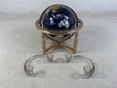 Lot 96 - A specimen globe in a brass style support...