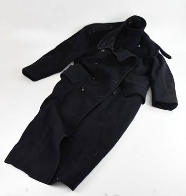 Lot 1314 - A vintage military navy blue great coat.