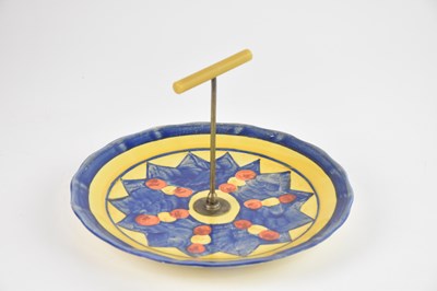 Lot 331 - CLARICE CLIFF; an Art Deco hand-painted cake...
