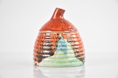 Lot 358 - CLARICE CLIFF; a small beehive honey pot,...