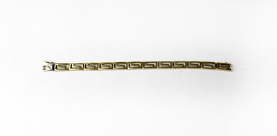 Lot 989 - A yellow metal Greek Key design bracelet.