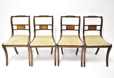 Lot 23 - A set of four Regency-style bar-back dining...