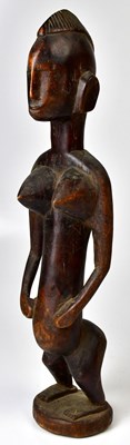 Lot 219 - A Bamana carved hardwood female figure on...