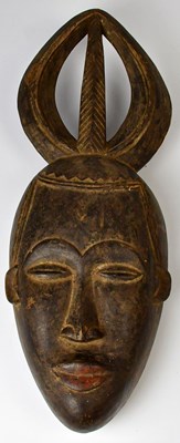 Lot 217 - An Ivory Coast Baule portrait mask, height 48cm.