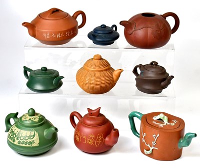 Lot 208 - A collection of nine various Yixing teapots...
