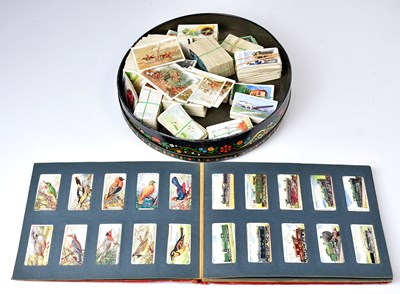 Lot 491 - A collection of cigarette cards comprising a...