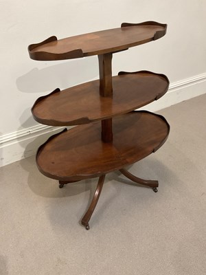 Lot 1135 - A 19th century mahogany three tier occasional...