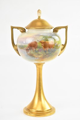 Lot 1311 - ROYAL WORCESTER; a twin handled pedestal vase...