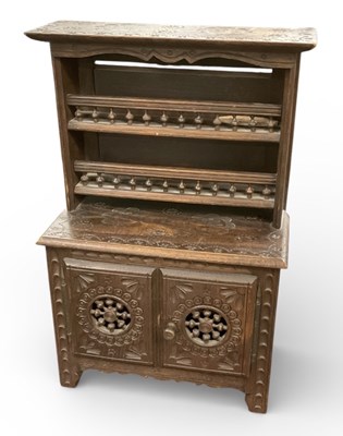 Lot 392 - An early 20th century carved oak miniature...