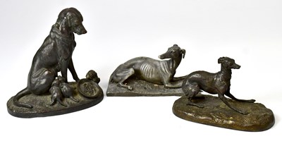 Lot 226 - A 19th century bronzed model of a dog nursing...