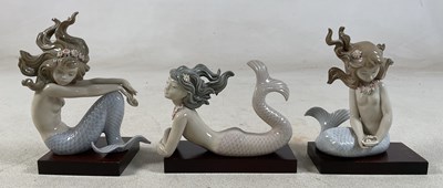 Lot 190 - LLADRO; three mermaid figures comprising...