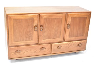 Lot 4 - ERCOL; a Windsor honey-coloured sideboard,...