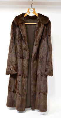 Lot 374 - Three fur coats, comprising a three-quarter...