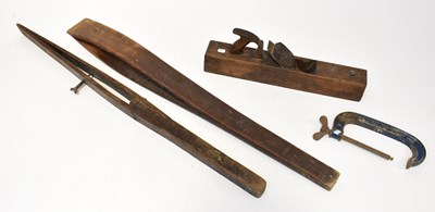 Lot 294 - Four vintage joinery tools, including a plane,...