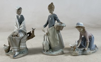 Lot 203 - LLADRO; two figures comprising a seated lady...