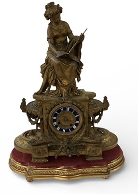 Lot 148 - A late 19th century gilt metal figural mantel...