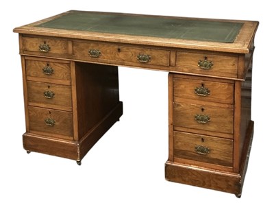 Lot 52 - An early 20th century oak pedestal kneehole...