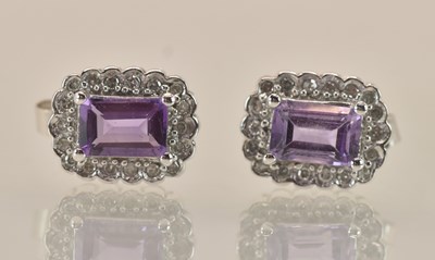 Lot 1491 - A pair of 9ct white gold amethyst and diamond...