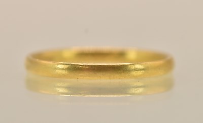 Lot 1344 - A 22ct yellow gold band ring, size P, approx 2....