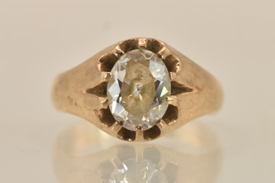 Lot 1373 - A 10K yellow gold white stone set signet ring,...