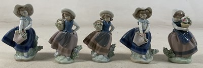 Lot 195 - LLADRO; five figures of young girls holding a...