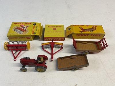 Lot 102 - DINKY TOYS; five farm implements by Dinky...