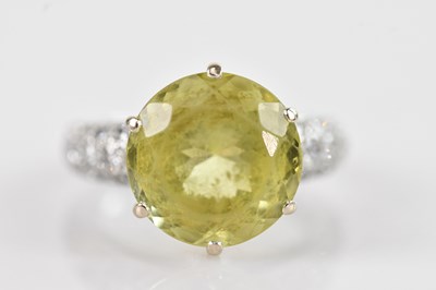 Lot 456 - A white metal lemon quartz dress ring, the...