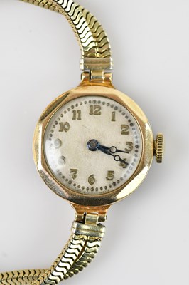 Lot 1107 - A lady's 9ct gold wristwatch, the dial set...