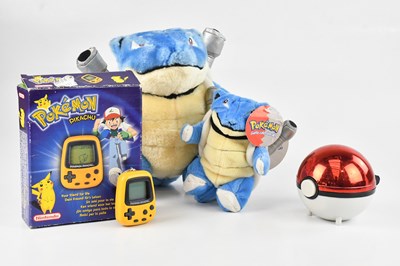 Lot 1627 - POKÉMON; a pocket Pikachu, with box, two plush...
