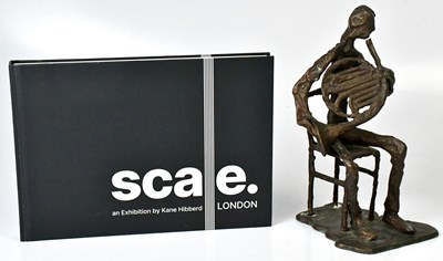 Lot 627 - A bronze sculpture of a figure playing a...