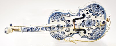 Lot 149 - DELFT; a ceramic violin decorated with blue...
