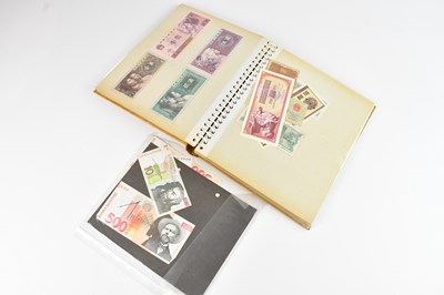 Lot 619 - An album of banknotes including Yugoslavian...