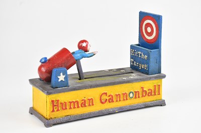 Lot 1224 - A reproduction Human Cannonball money bank, 21cm.