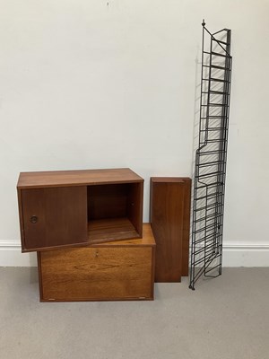 Lot 1001 - A mid century teak wall system, with two...