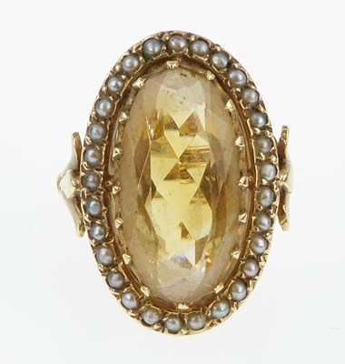 Lot 963 - A 9ct gold citrine and pearl dress ring, the...