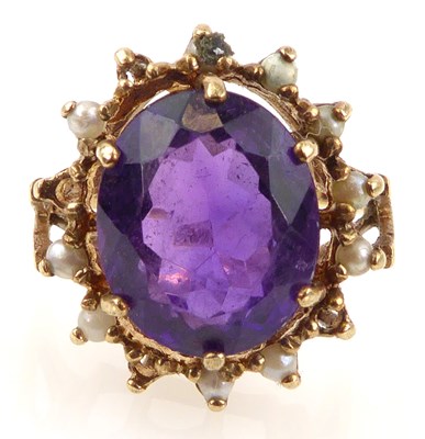 Lot 957 - A 9ct gold amethyst and seed pearl dress ring,...