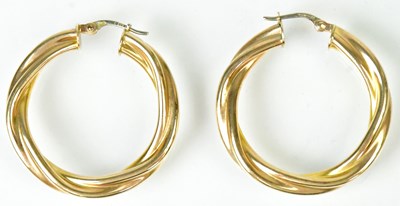 Lot 836 - A pair of 9ct yellow gold twist hoop earrings,...