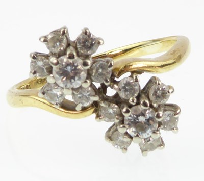 Lot 940 - An 18ct gold diamond double flower head...