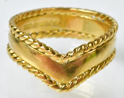 Lot 709 - An 18ct yellow gold chevron-shaped band ring,...