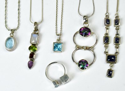 Lot 820 - Five necklaces, comprising a pendant set with...