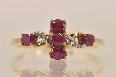 Lot 1382 - A 9ct yellow gold ruby and diamond set ring,...