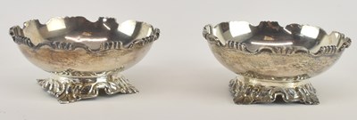 Lot 1147 - A pair of white metal circular footed dishes...